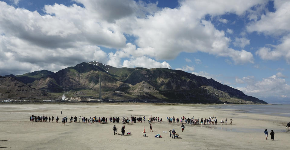 A gathering at the Great Salt Lake in hopes of making it into the record books fell way short Saturday, June 8, 2019, near Magna, Utah. Utah park officials invited people to a beach on the lake's south end in an attempt to set the world record for the largest number of people floating together, unassisted, in a line at one time. Utah State Parks manager Jim Wells said only about 300 people showed up for the event. According to the Guinness World Records website , Argentina holds the current record after 1,941 people successfully floated together on the surface of Lago Epecuén de Carhué in 2017. (AP Photo/Rick Bowmer)