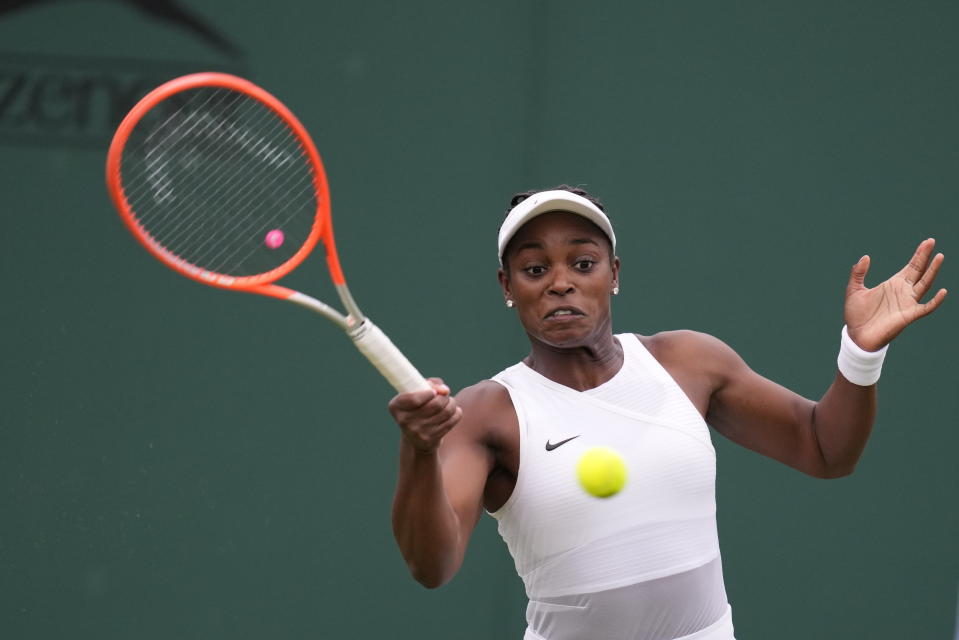 Sloane Stephens of the US plays a return to Kristie Ahn of the US during the women's singles second round match on day three of the Wimbledon Tennis Championships in London, Wednesday June 30, 2021. (AP Photo/Kirsty Wigglesworth)