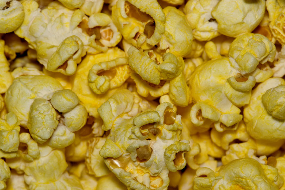 Cheesy popcorn close up.