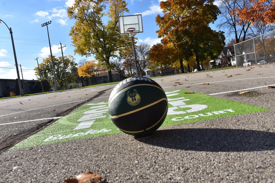 The Milwaukee Bucks teamed up with Colectivo Coffee, Milwaukee Parks Foundation, and Chris and Jennifer Abele to restore the basketball courts at Atkinson Triangle Park.