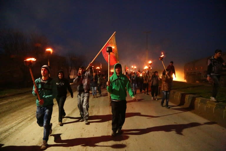 Syrian Kurds demonstrate against the curfew imposed by the Turkish army in the town of Cizre, on February 8, 2016, in the northeastern Syrian city of Qamishli