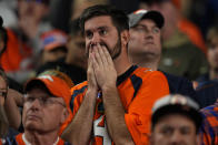 A Denver Broncos fan watches during the second half of an NFL football game against the Indianapolis Colts, Thursday, Oct. 6, 2022, in Denver. (AP Photo/Jack Dempsey)