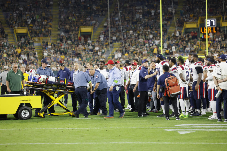 New England Patriots cornerback Isaiah Bolden is carted off the field during the second half of a preseason NFL football game against the Green Bay packers Saturday, Aug. 19, 2023, in Green Bay, Wis. The game was cancelled after the injury. (AP Photo/Jeffrey Phelps)