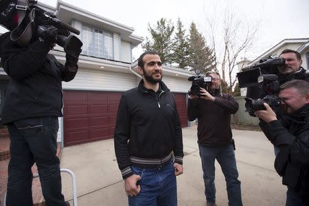 Omar Khadr walks to meet the press before a news conference after being released on bail in Edmonton, Alberta, May 7, 2015. REUTERS/Todd Korol