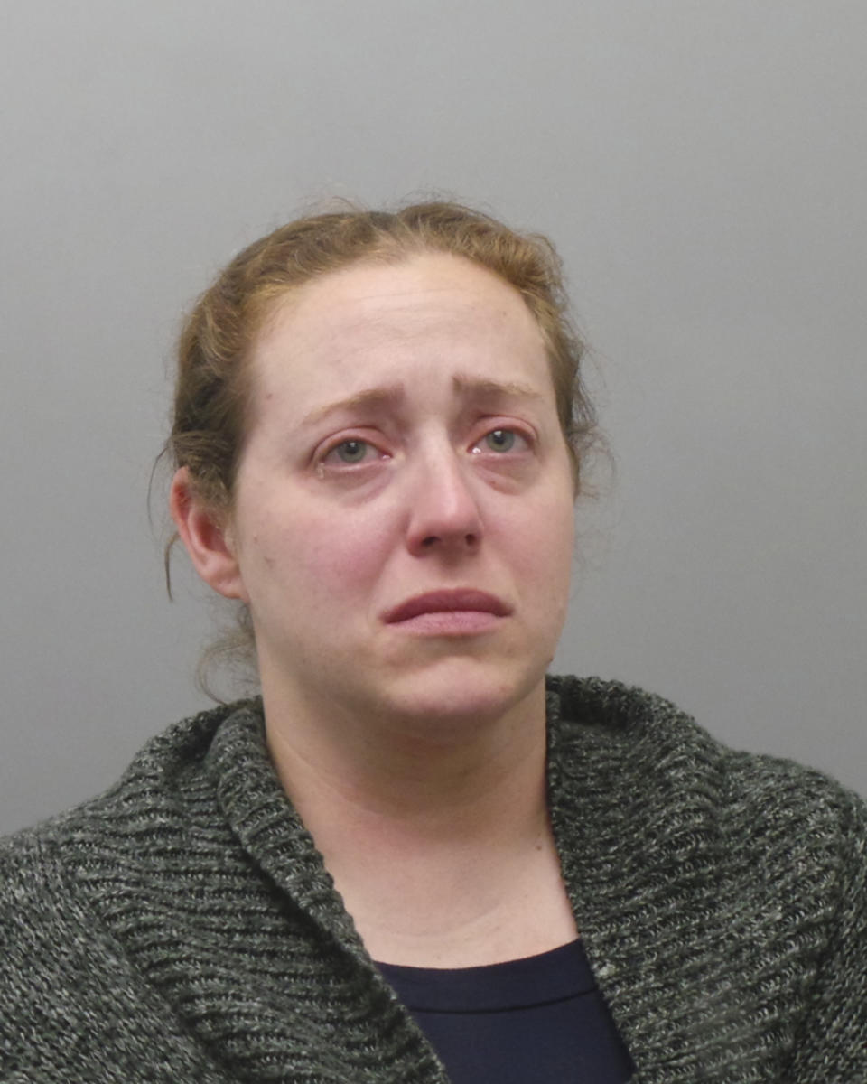 This undated photo provided by the St. Louis County Police Department shows Ladue, Mo., Police Officer Julia Crews, 37, who was charged Wednesday, May 1, 2019, with second-degree assault. Authorities say Crews meant to use a stun gun but accidently shot her service revolver during a confrontation with a shoplifting suspect outside a grocery store. The 33-year-old woman who was shot remains hospitalized. (St. Louis County Police via AP)