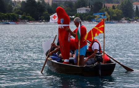 Bulgarian Yane Petkov, 64, wants to set a new Guinness World Record by attempting to swim more than three kilometers at Macedonia's Lake Ohrid in a bag with his arms and legs tied up, in Ohrid, Macedonia July 24, 2018. REUTERS/Ognen Teofilovski