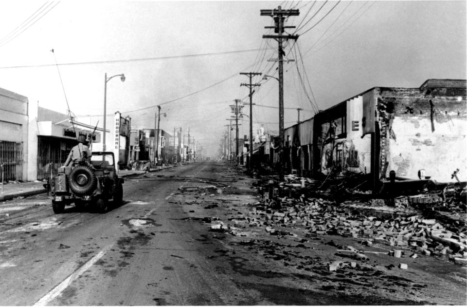 National guardsman driving through Watts in 1965. (Credit: PhotoQuest/Getty Images)