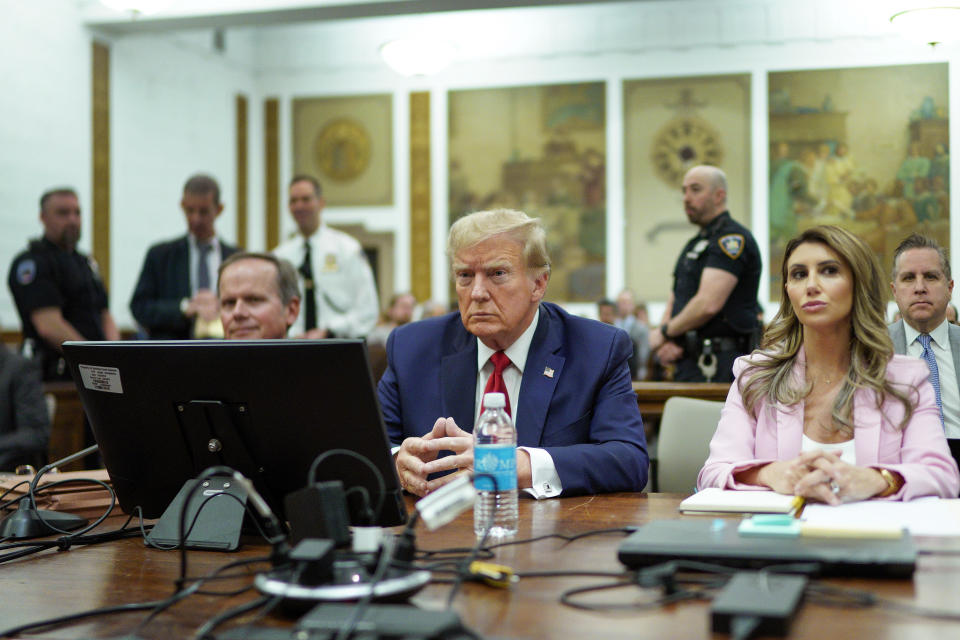 Former President Donald Trump sits at the defense table flanked by attorneys Christopher Kise, left, and Alina Habba, right, at New York Supreme Court on Dec. 7. (Eduardo Munoz Alvarez/AP)