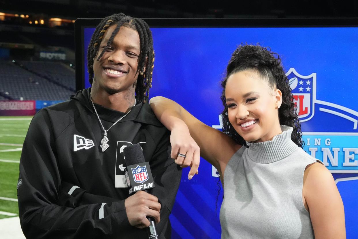 Alabama Crimson Tide wide receiver Jameson Williams, left, poses with NFL Network reporter Kimmi Chex during the NFL Scouting Combine at Lucas Oil Stadium on March 3, 2022.
