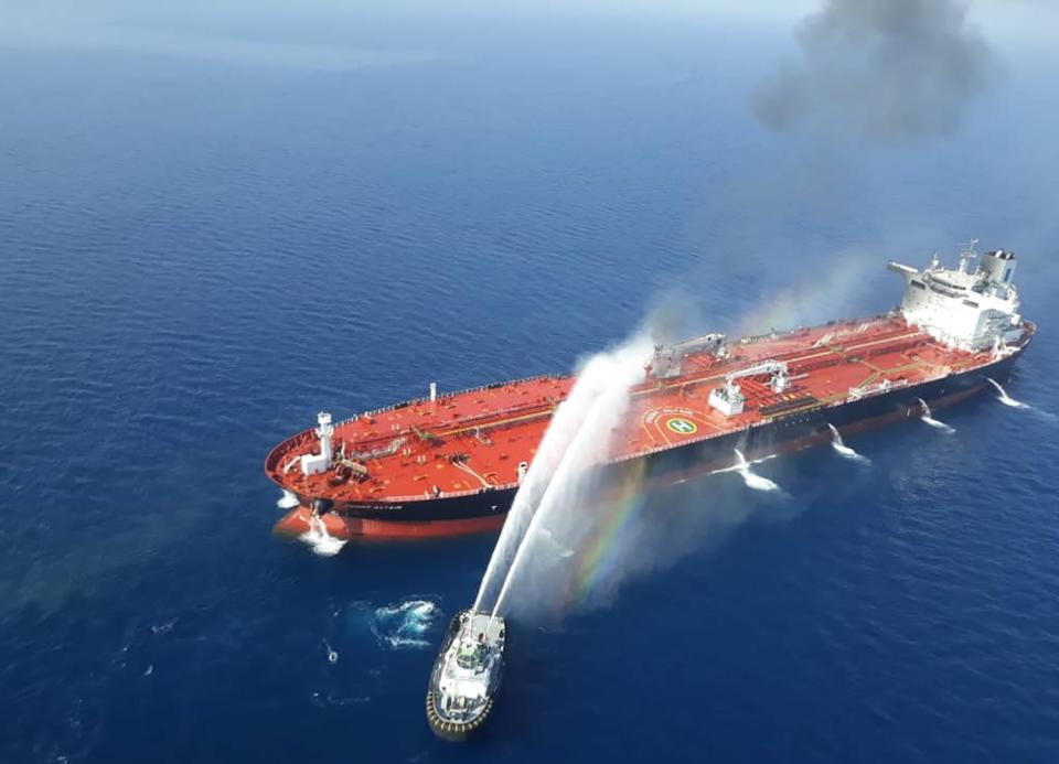 TOPSHOT - A picture obtained by AFP from Iranian news agency Tasnim on June 13, 2019 reportedly shows an Iranian navy boat trying to control fire from Norwegian owned Front Altair tanker said to have been attacked in the waters of the Gulf of Oman. - Suspected attacks left two tankers in flames in the waters of the Gulf of Oman today, sending world oil prices soaring as Iran helped rescue stricken crew members. The mystery incident, the second involving shipping in the strategic sea lane in only a few weeks, came amid spiralling tensions between Tehran and Washington, which has pointed the finger at Iran over earlier tanker attacks in May.

Subject : IRAN OIL TANKER 5 (Photo by - / TASNIM NEWS / AFP)-/AFP/Getty Images ORIG FILE ID: AFP_1HH6NY