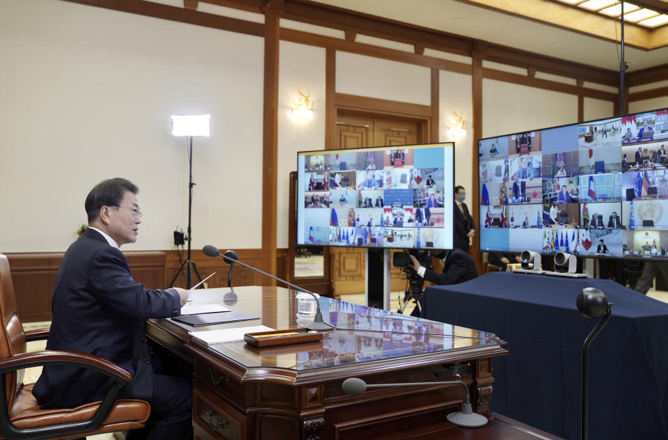 In this photo provided by South Korea Presidential Blue House via Yonhap News Agency, South Korean President Moon Jae-in attends G-20 virtual summit to discuss the coronavirus disease outbreak at the presidential Blue House in Seoul, South Korea, Thursday, March 26, 2020. Leaders of the world's most powerful economies will convene virtually to coordinate a response to the fast-spreading new coronavirus. The new coronavirus causes mild or moderate symptoms for most people, but for some, especially older adults and people with existing health problems, it can cause more severe illness or death. (South Korea Presidential Blue House/Yonhap via AP)