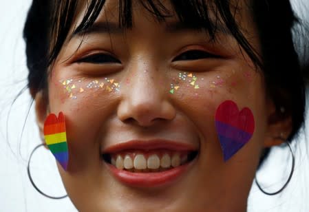 FILE PHOTO: A participant of Pink Dot, an annual event organised in support of the LGBT community, is seen at the Speakers' Corner in Hong Lim Park in Singapore