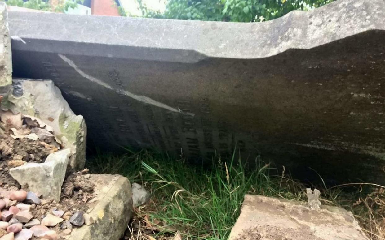 The broken headstone could cost