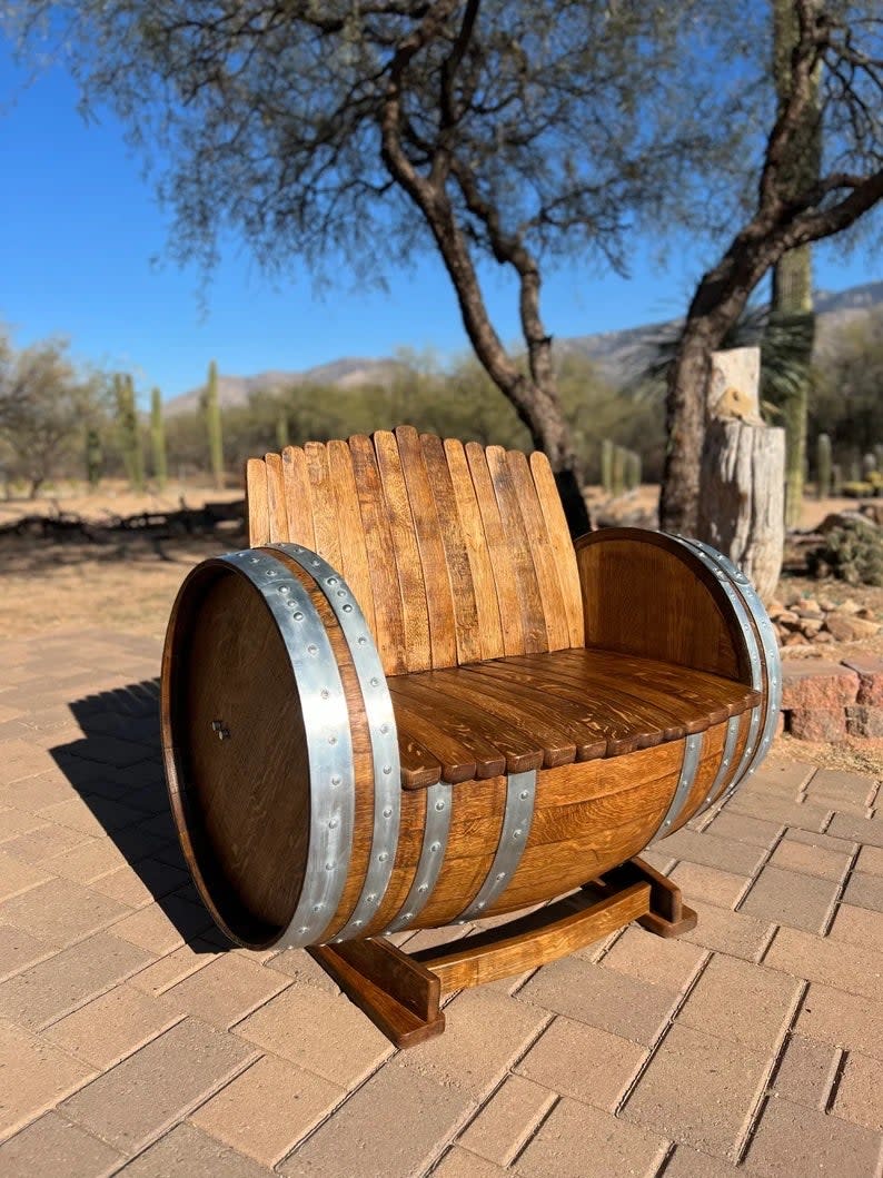 Garden bench crafted out of an old barrel.