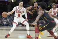 Jan 21, 2019; Cleveland, OH, USA; Chicago Bulls guard Zach LaVine (8) dribbles against Cleveland Cavaliers guard Rodney Hood (1) and guard Collin Sexton (2) in the third quarter at Quicken Loans Arena. Mandatory Credit: David Richard-USA TODAY Sports