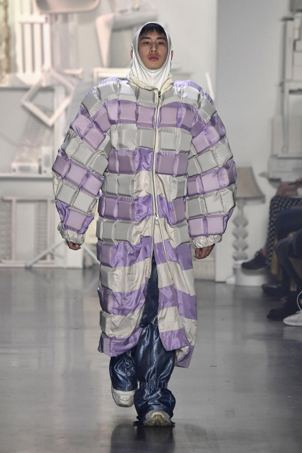 This coat by designer Yufei Liu (from the Rhode Island School of Design) definitely falls squarely into the <a href="https://www.huffingtonpost.com/entry/fall-2018-trend-oversized-coats_us_5b97e065e4b0162f47315a24" target="_blank" rel="noopener noreferrer">"oversized" trend</a> box and it's anything but basic.