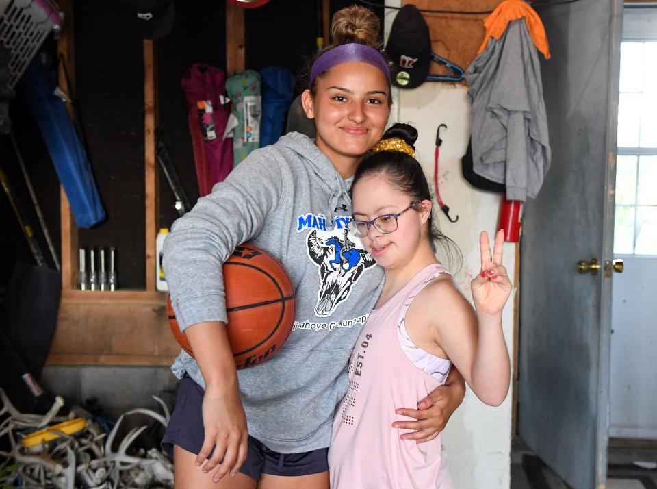 Stevi Fallis, left, smiles for a photo with her younger sister, Stephanie, on Wednesday, June 16, 2021, on the Pine Ridge Reservation.