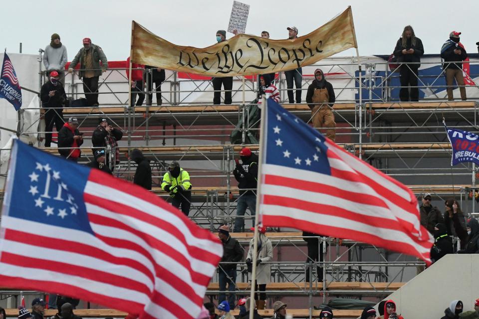 three percenters flags wave at the capitol insurrection