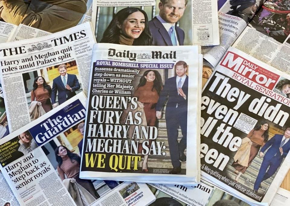 The covers of various UK newspapers with headlines about Harry and Meghan, including "They Didn't Even Tell the Queen" and "Harry and Meghan Quit Roles Amid Palace split"