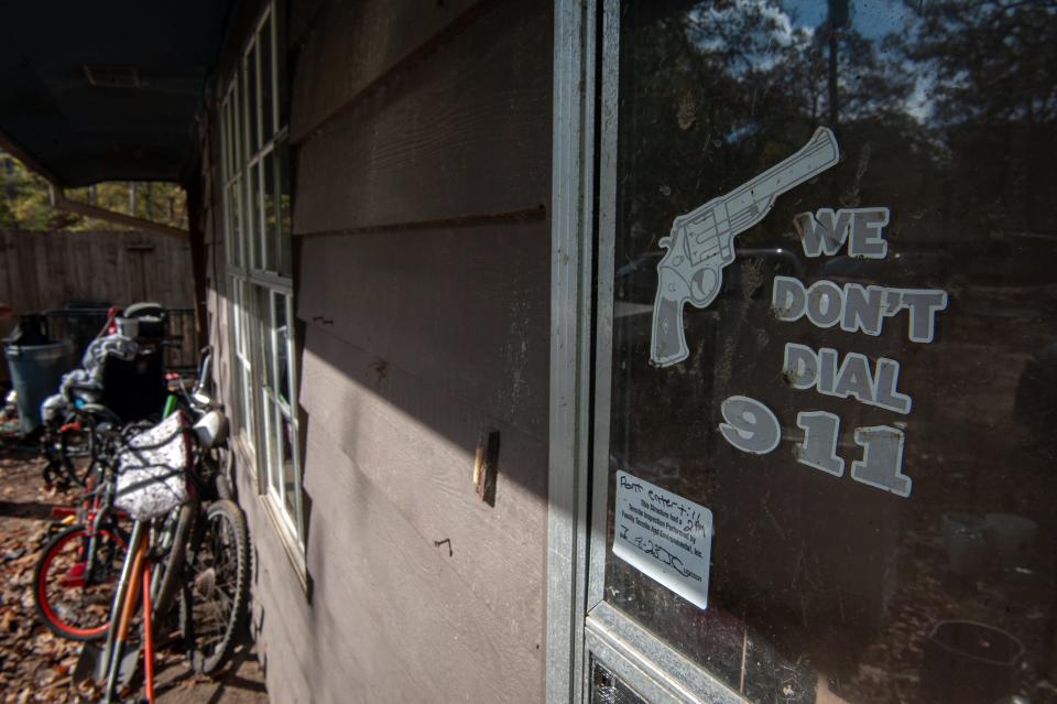 A sign remains on the front door of a home in the Robinhood neighborhood near Brandon, Mississippi on Nov. 24, 2023. Rory Doyle for The New York Times