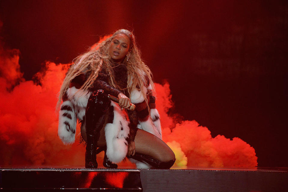 Beyoncé kneeling onstage