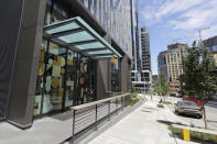 The entrance to Mary's Place, a family homeless shelter located inside an Amazon corporate building on the tech giant's Seattle campus, is shown Wednesday, June 17, 2020. The shelter marks a major civic contribution bestowed by Amazon to the hometown it has rapidly transformed. But the facility also serves as a stark display of haves-and-have-nots, given that some blame Amazon's explosive growth over the past decade for making living in Seattle too costly for a growing number of people. (AP Photo/Ted S. Warren)