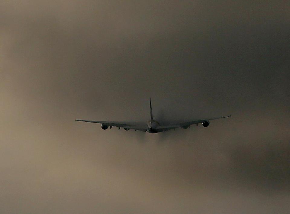 A jet flies into clouds.