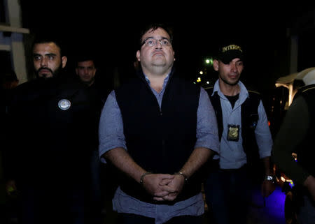 Former governor of Mexican state Veracruz Javier Duarte (C) is escorted by authorities after he was detained in a hotel in Panajachel, Guatemala 15 April 2017. REUTERS/Danilo Ramirez