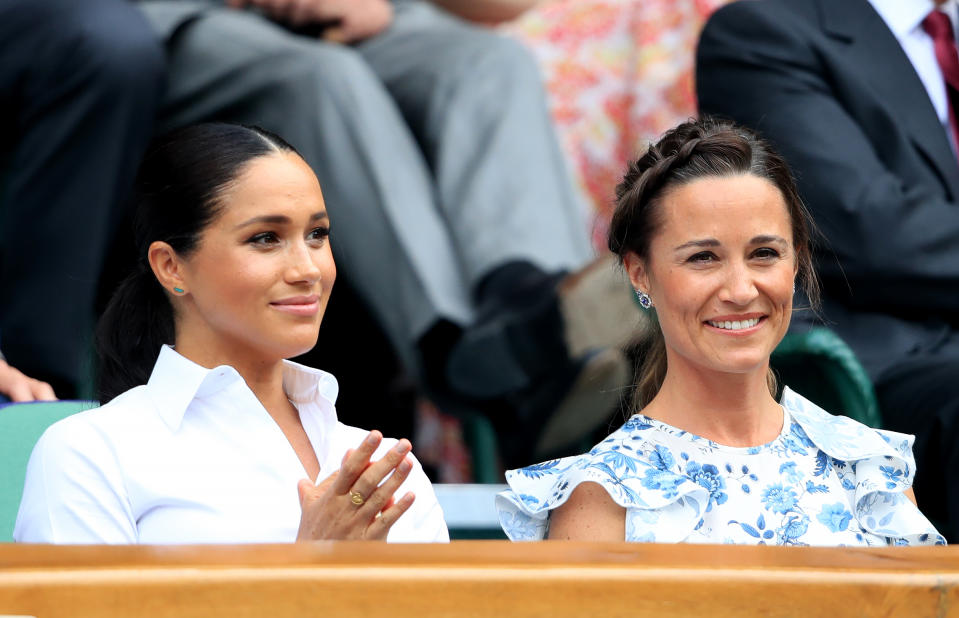 The Duchess of Sussex alongside Pippa Matthews on day twelve of the Wimbledon Championships at the All England Lawn Tennis and Croquet Club, Wimbledon.