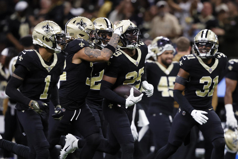 New Orleans Saints cornerback Paulson Adebo (29) celebrates with teammates after recovering a fumble by Chicago Bears wide receiver DJ Moore during the second half of an NFL football game in New Orleans, Sunday, Nov. 5, 2023. (AP Photo/Butch Dill)