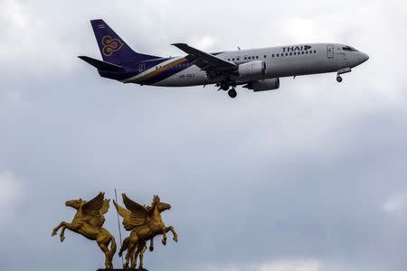 A Thai Airways plane prepares to land at Bangkok's Suvarnabhumi Airport July 17, 2014. REUTERS/Athit Perawongmetha