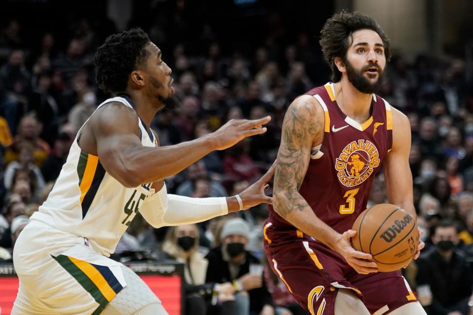 Cleveland Cavaliers' Ricky Rubio (3) drives against Utah Jazz's Donovan Mitchell (45) in the second half of an NBA basketball game, Sunday, Dec. 5, 2021, in Cleveland. Utah won 109-108. (AP Photo/Tony Dejak)