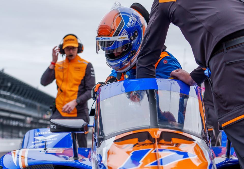 Rookie IndyCar driver Kyle Larson (17) sits down into his car Wednesday, April 10, 2024, during open testing at Indianapolis Motor Speedway ahead of the 108th running of the Indianapolis 500.