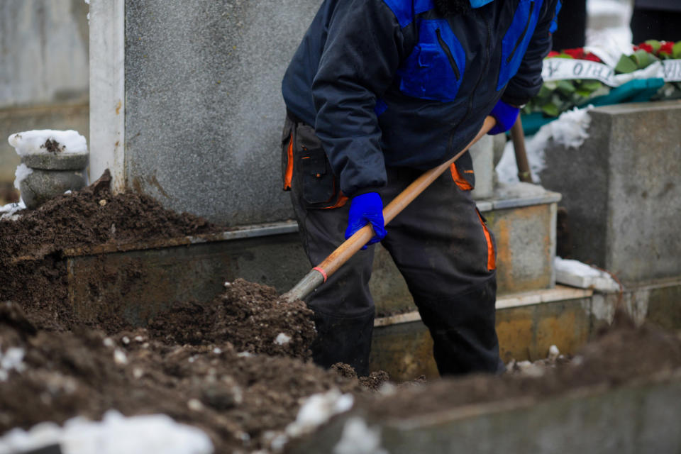 Man digging graveyard