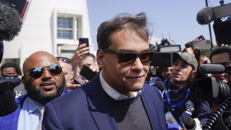 U.S. Rep. George Santos leaves the federal courthouse in Central Islip, N.Y., Wednesday, May 10, 2023. A 13-count federal indictment unsealed in New York accuses U.S. Rep. George Santos of embezzling money from his campaign, falsely receiving unemployment funds and lying to Congress about his finances.