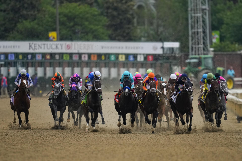 Horses run after leaving the starting gate during the 149th running of the Kentucky Derby horse race at Churchill Downs Saturday, May 6, 2023, in Louisville, Ky. (AP Photo/Julio Cortez)