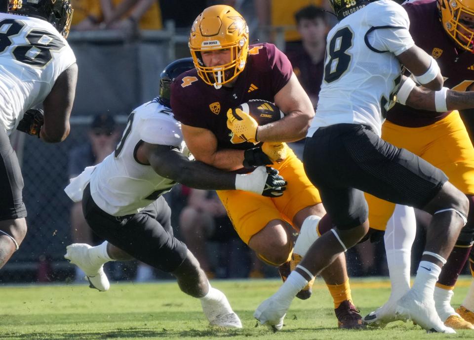 ASU Sun Devils running back Cam Skattebo (4) carries the ball against the Colorado Buffaloes, Oct. 7, 2023, at Mountain America Stadium.