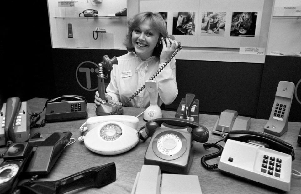 Sales officer Deborah Eden demonstrates the latest range of British Telecom telephones in November 1981 (PA) (PA Archive)