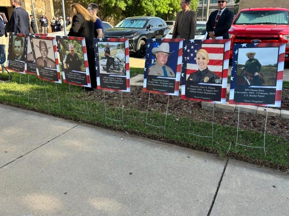 Images of fallen law enforcement who died while serving in the line of duty are displayed in remembrance in front of the Abilene Taylor County Law Enforcement Center Wednesday.