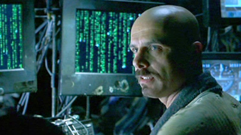 Joe Pantoliano causing mischief in The Matrix (Image by Warner Bros)