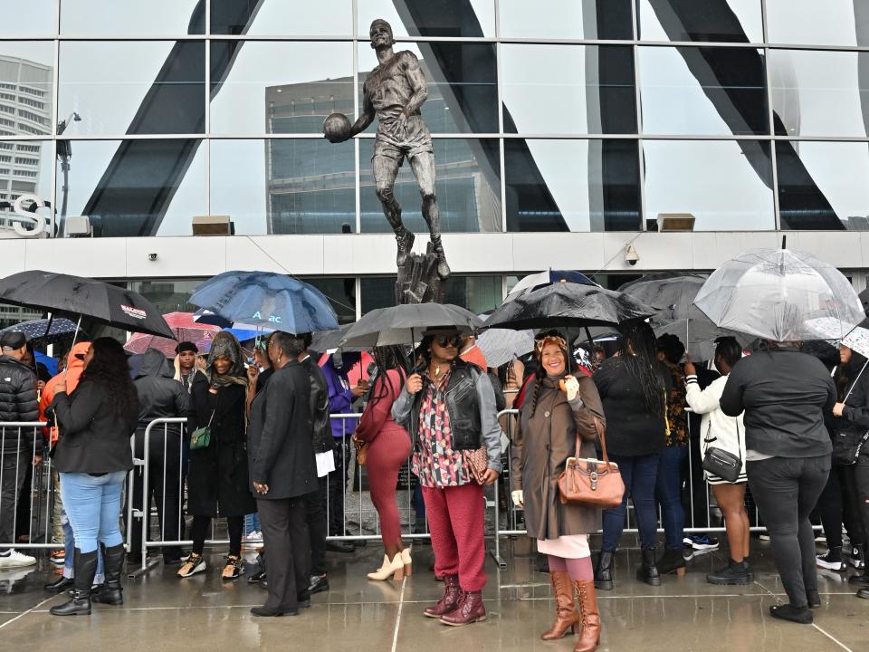 People in line outside an arena