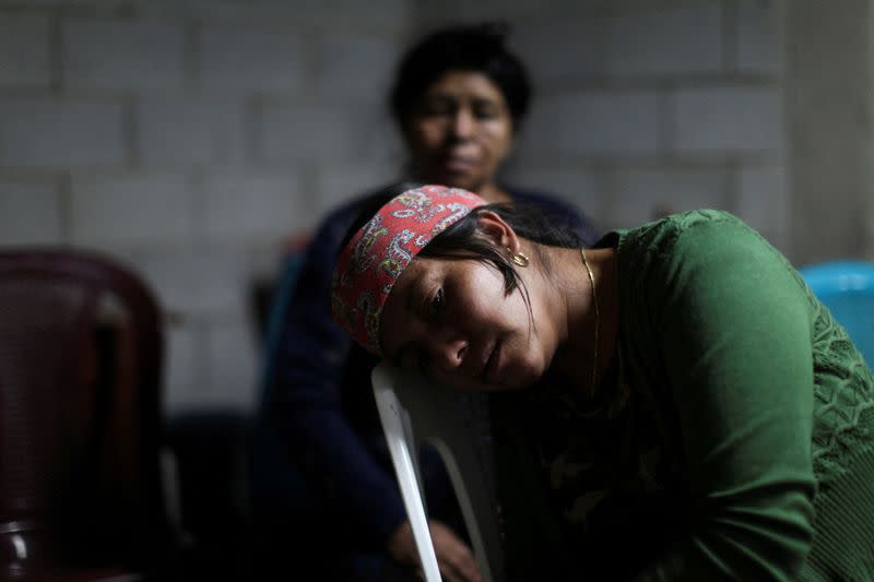 FILE PHOTO: Family and friends gather to mourn the dead of their loved ones who died in the U.S., in Nahuala