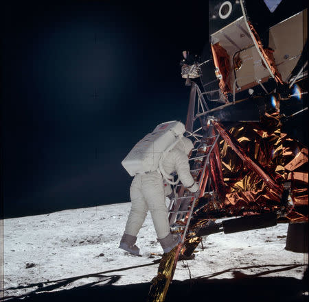 Astronaut Edwin E. Aldrin Jr., lunar module pilot, descends the steps of the Lunar Module (LM) ladder as he prepares to walk on the moon during the Apollo 11 mission July 20, 1969. REUTERS/NASA/Handout