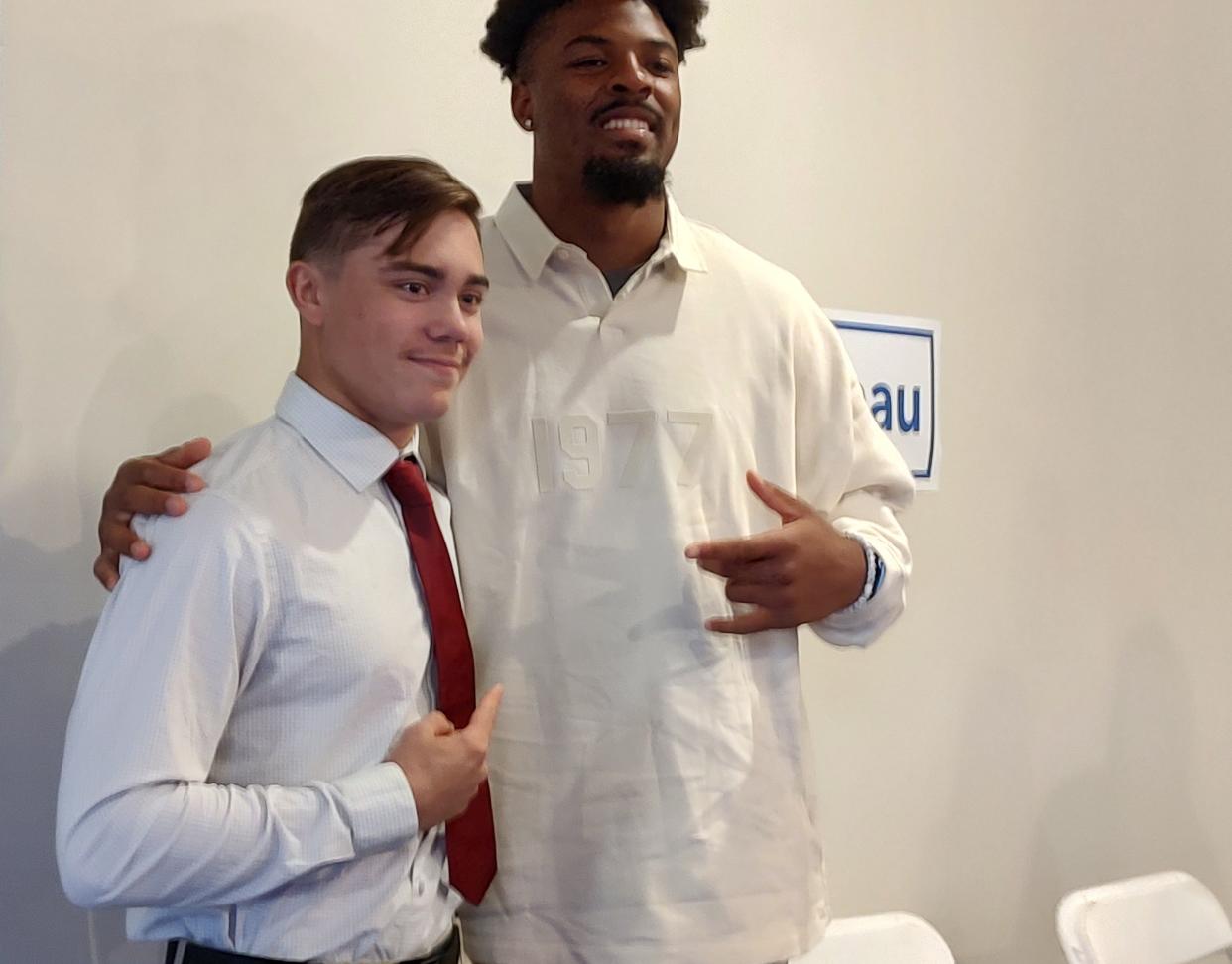 Buffalo Bills defensive end Gregory Rousseau grabs a photo with Co-Male Athlete of the Year Beau Zeh of Canisteo-Greenwood at the 48th annual Hornell Sports Night Saturday, April 13, 2024 at The Main Place. The event supports the Special Olympics.