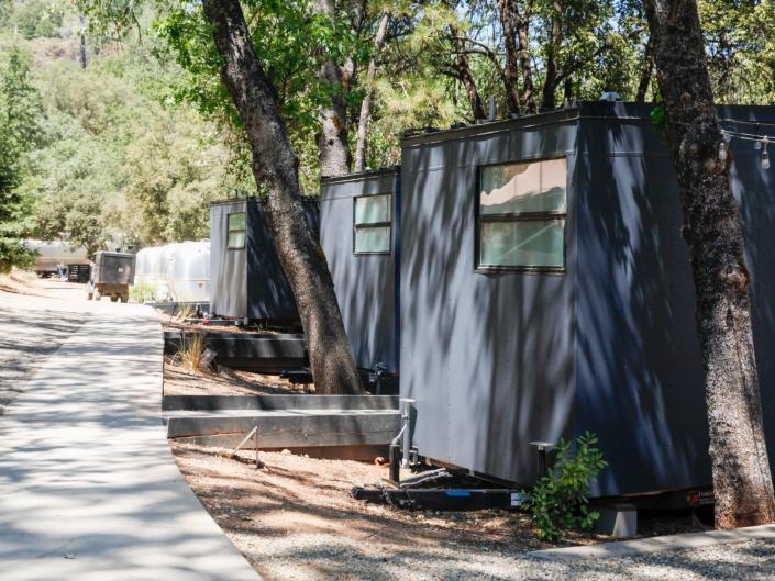 a row of Autocamp Yosemite's cabins
