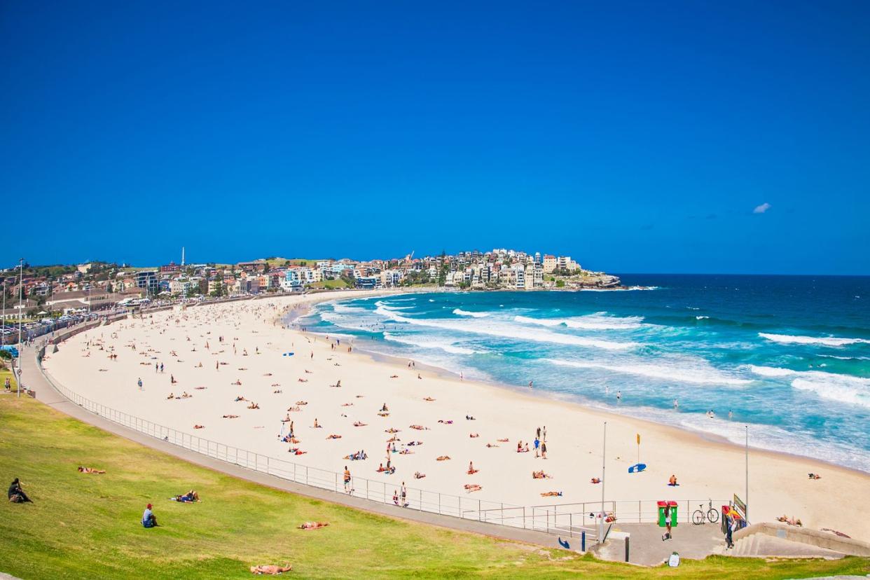 people relaxing on the bondi beach in sydney, australia bondi beach is one of the most famous beach in the world