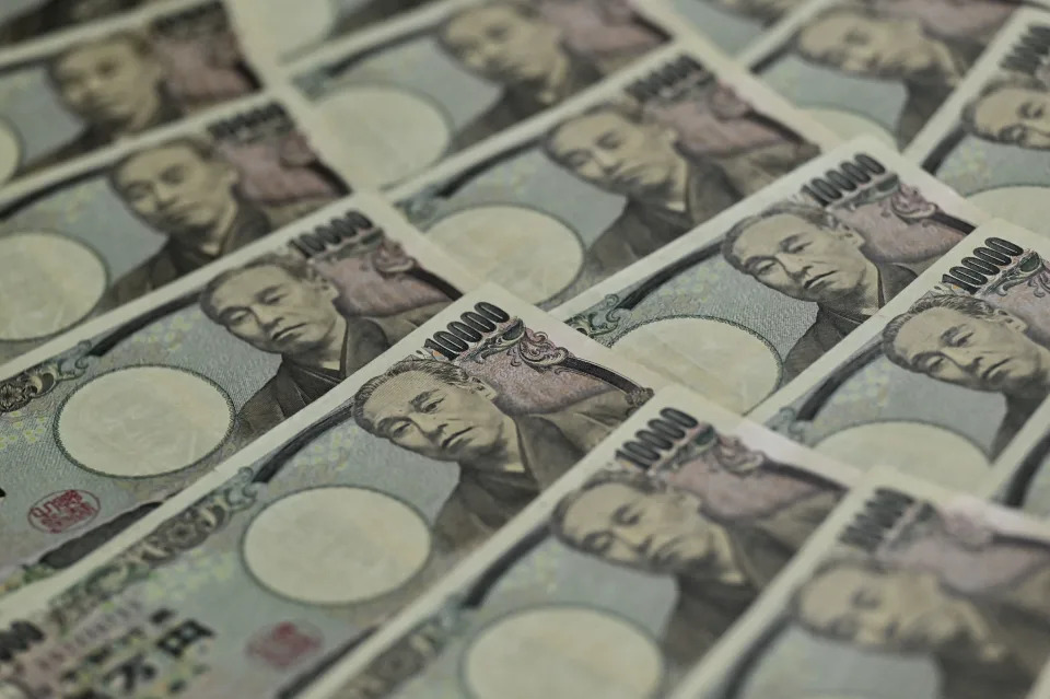 This photo illustration taken on September 24, 2022 shows Japanese 10,000 yen notes (apprx. 69 USD) on display in Tokyo. - Japan&#39;s finance ministry on September 22 intervened in the currency market to bolster the yen, which has plummeted against the US dollar in recent months on the widening policy gap between the US and Japanese central banks. (Photo by Richard A. Brooks / AFP) (Photo by RICHARD A. BROOKS/AFP via Getty Images)