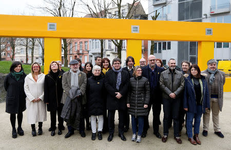 Former Catalan leader Carles Puigdemont poses with members of his party 'Junts per Catalunya' parliament group in Brussels, Belgium January 12, 2018. REUTERS/Francois Lenoir