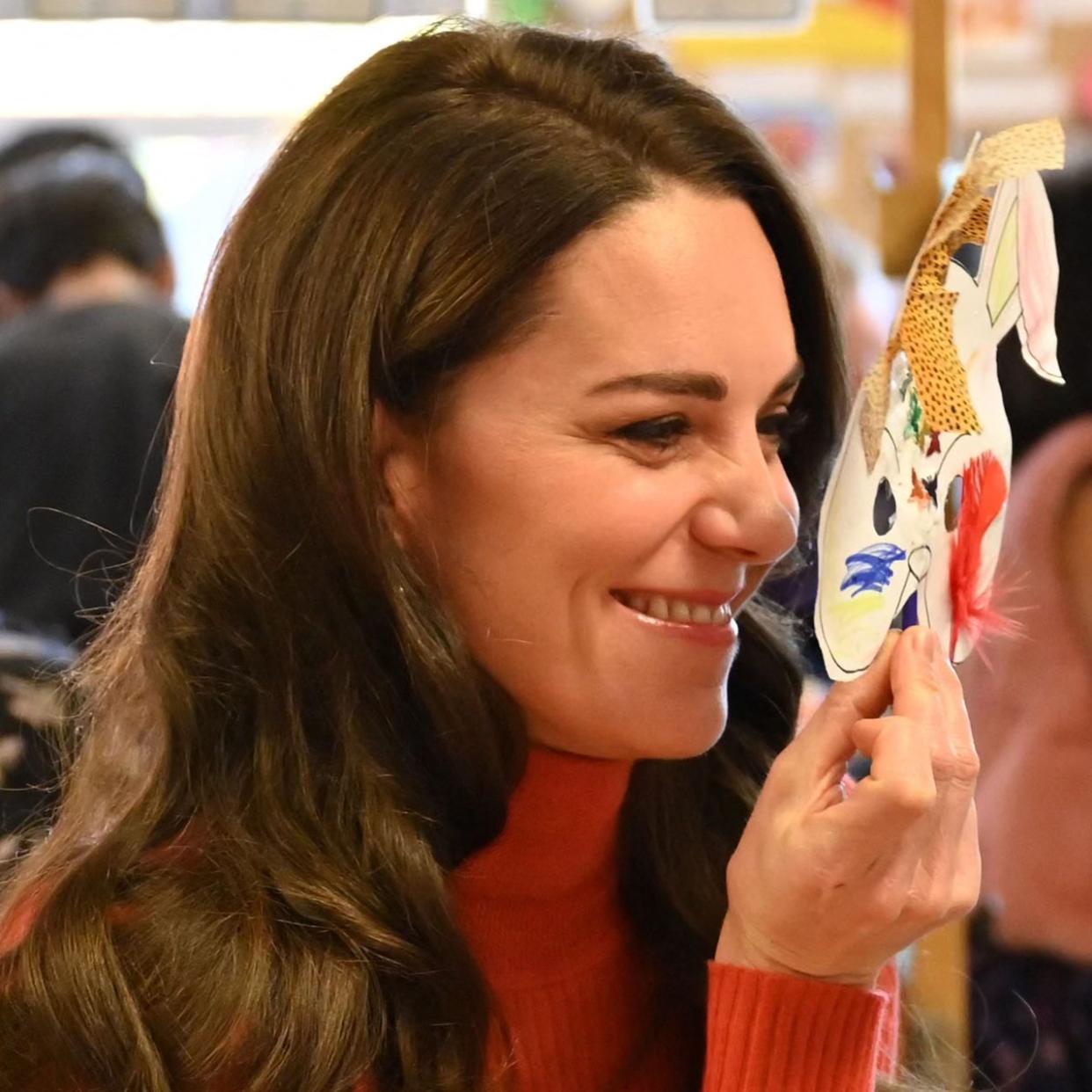  Britain's Catherine, Princess of Wales holds a mask to her face as she interacts with children during her visit to Foxcubs Nursery in Luton, north of London on January 18, 2023, as part of her ongoing work to elevate the importance of early childhood to lifelong outcomes. 