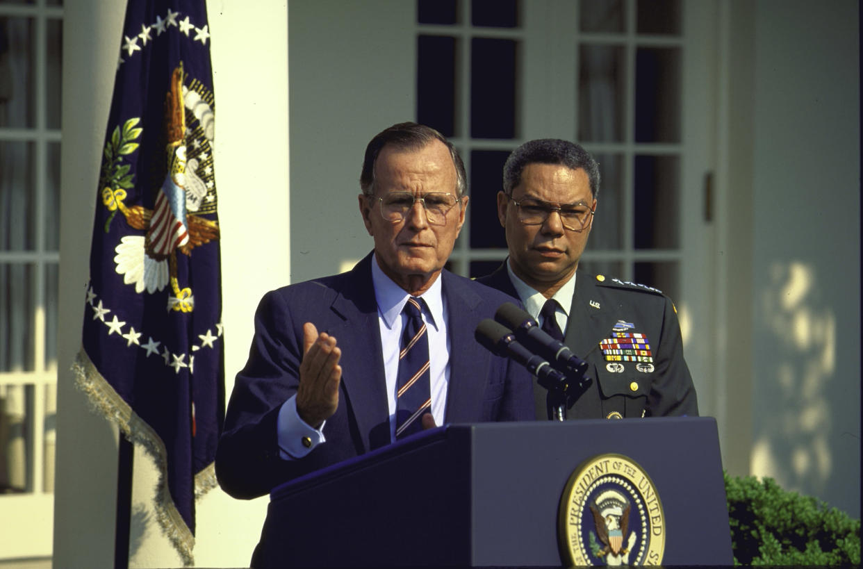 President George H.W. Bush announces the reappointment of Colin Powell, right, as chairman of the Joint Chiefs of Staff in 1991. (Photo: Diana Walker/Time Life Pictures/Getty Images)